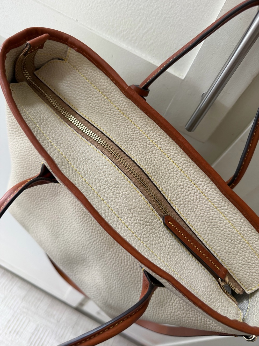 Dooney & Bourke Cream and Brown Pebbled Leather Tote with Charm - Picture 4 of 5